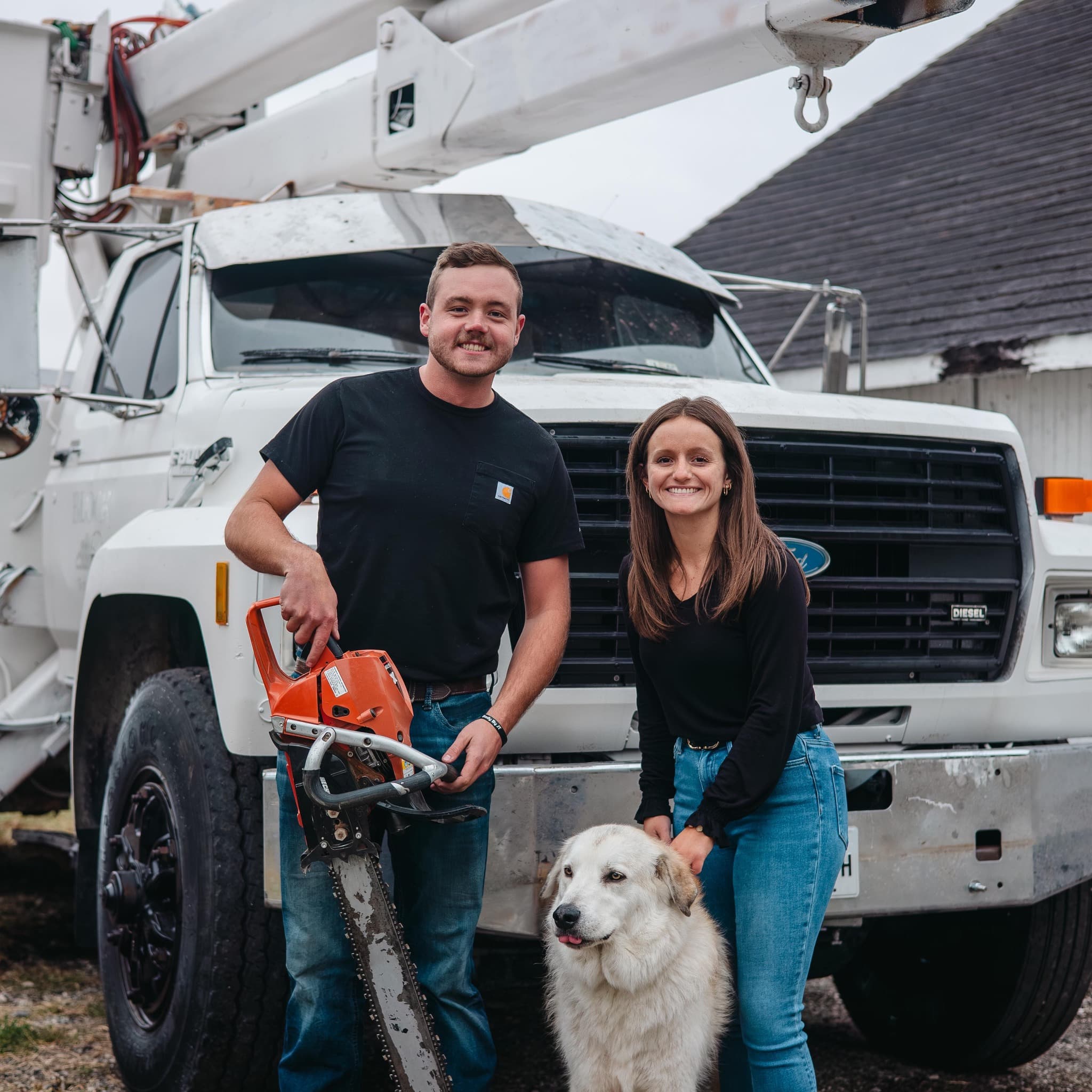 Timberview Tree & AG Services owners with their bucket truck and equipment